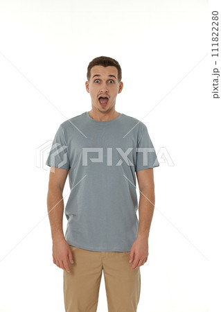 surprised guy looking at camera on white studio background 111822280