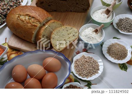 Ingredients for whole grain healthy bread, whole wheat flour, wheat germ and eggs 111824502