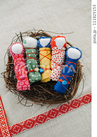 Handmade Motanka Dolls in a Nest for Good Luck. colorful handmade Motanka dolls, a traditional Slavic charm for luck and prosperity, with ethnic patterns. Handmade Motanka Dolls in a Nest for Good Luck. colorful handmade Motanka dolls, a traditional Slavic charm for luck and prosperity, with ethnic patterns. 111825153