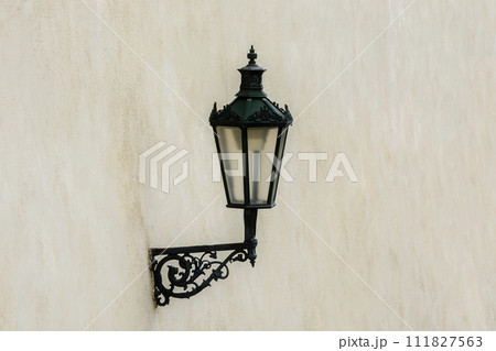 Lantern on a beige wall. 111827563