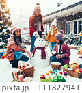 AI-generated content. Happy children gathering in snow-covered yard together sculpting funny snowman from snow. 111827941