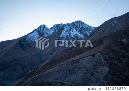 Blue cold Caucasus mountains, snowy peaks Blue cold Caucasus mountains, snowy peaks 111828870