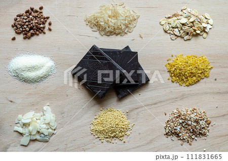 Assorted cereal grain porridge seeds set on a wooden background Assorted cereal grain porridge seeds set on a wooden background 111831665
