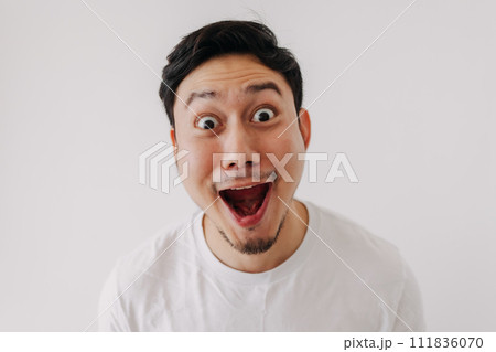 Happy funny big smile face of man wears white t-shirt portrait isolated on white background. Happy funny big smile face of man wears white t-shirt portrait isolated on white background. 111836070