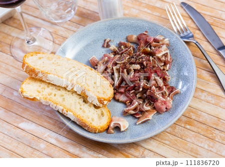 Sliced pig ears served on platter Sliced pig ears served on platter 111836720