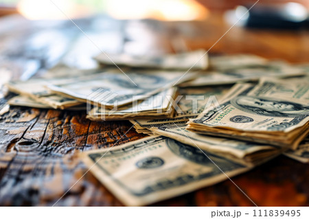 AI-generated content. A collection of currency, stacked in a pile, sitting atop a sturdy wooden table. AI-generated content. A collection of currency, stacked in a pile, sitting atop a sturdy wooden table. 111839495