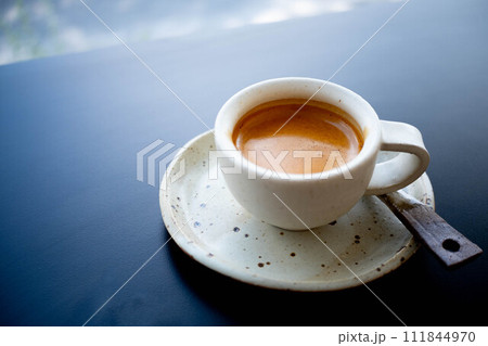 A Ceramic Cup of Espresso Double shot coffee on the table 111844970