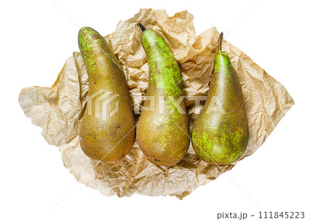 Pears on Kraft paper. Seasonal ripe pears. Isolated on white background. Top view. Pears on Kraft paper. Seasonal ripe pears. Isolated on white background. Top view. 111845223