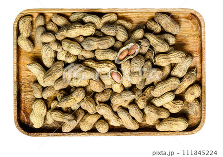 Peanuts in a shell. Organic raw groundnut. Isolated on white background. Top view. 111845224