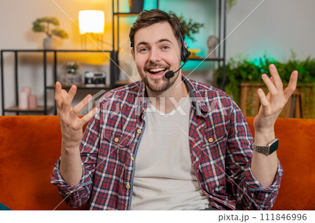 Caucasian man wearing headset freelance worker call center support service operator helpline at home Caucasian man wearing headset freelance worker call center support service operator helpline at home 111846996