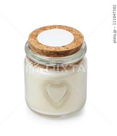 Closed glass jar with aromatic candle inside isolated on white background 111847382