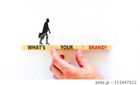 Branding and what is your brand symbol. Concept words What is your brand on beautiful blocks. Beautiful white background. Businessman hand. Business branding what is your brand concept. Copy space. 111847812