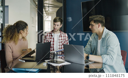 Team of business people developing plan of startup, communication in office Team of business people developing plan of startup, communication in office 111848175