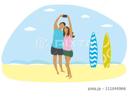 Happy couple in love on ocean beach and two surfboards,people take a selfie 111848966