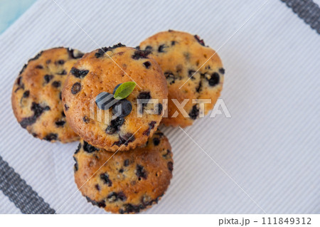 Homemade baked fresh blueberry muffins. Tasty pastry sweet cupcake dessert. Berry pie cupcakes with organic berries. Gluten free healthcare recipe from alternative flour  111849312