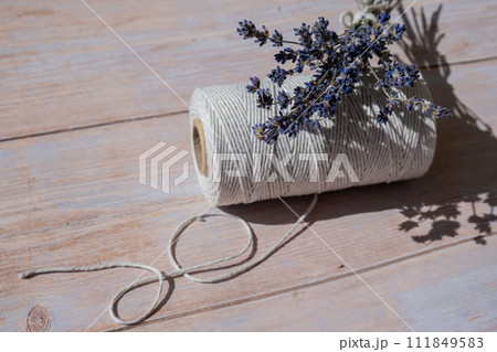 Dried lavender flowers on cotton rope. Esthetic aesthetic composition with copy space for wallpaper, black, template. Minimal eco style still life 111849583