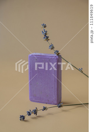 Handcrafted purple lavender soap with lavender flowers. Natural hydrating moisturiser softness cosmetic. Organic calming beauty skincare product. Herbal self care wellness alternative soap Handcrafted purple lavender soap with lavender flowers. Natural hydrating moisturiser softness cosmetic. Organic calming beauty skincare product. Herbal self care wellness alternative soap 111849619