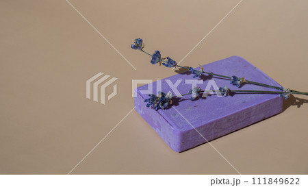 Lavender soap on beige background with copy space for your text. Advertisement template mock up. Skincare homemade natural cosmetic concept. Organic dry lavender flower 111849622