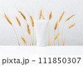 Cosmetic product on the table, white container for skin care decorated wheat ears 111850307