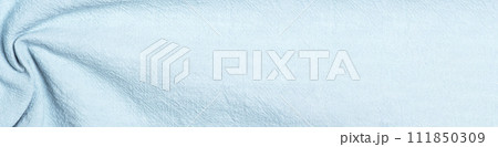 Banner of light blue fabric with folds, textured surface Banner of light blue fabric with folds, textured surface 111850309
