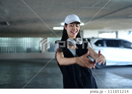 Talented young woman dancing Hip hop dance in parking garage. Hobby and active lifestyle concept Talented young woman dancing Hip hop dance in parking garage. Hobby and active lifestyle concept 111851214