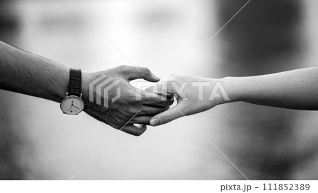 Holding hands, couple in love background, St. Valentine's day dating conceptual photo 111852389