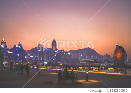 Calm evening ambiance as people enjoy the city waterfront. Jan 12 2024 111853363