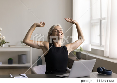 Woman relax on comfy chair after end of working day 111854488