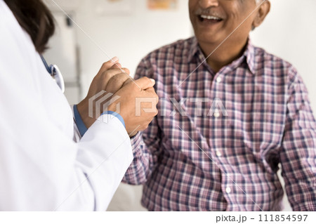 Positive cheerful elder man visiting doctor, consulting therapist 111854597