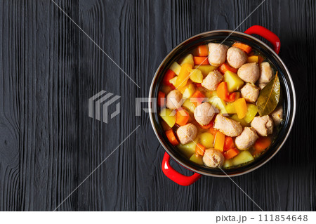 finnish sausage soup with vegetables in red pot finnish sausage soup with vegetables in red pot 111854648