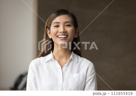 Happy beautiful young Asian manager woman posing indoors 111855819