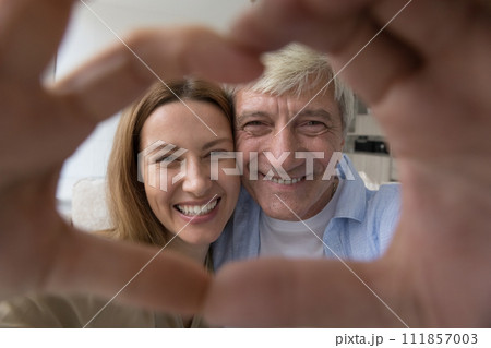 Cheerful senior dad and adult daughter child having fun 111857003