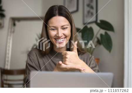 Cheerful hearing disability therapist talking on video conference call Cheerful hearing disability therapist talking on video conference call 111857262