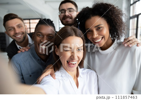 Group of happy, smiling office employees taking selfie at work Group of happy, smiling office employees taking selfie at work 111857463
