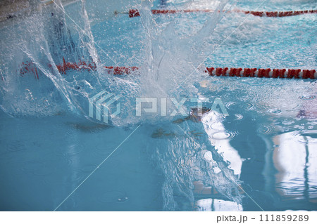 A man is swimming in the sports pool A man is swimming in the sports pool 111859289