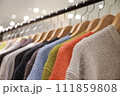 ハンガーにかかっているセーター 111859808
