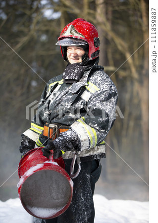 Firefighters extinguish a fire. Firefighter in the forest. Firefighters extinguish a fire. Firefighter in the forest. 111859887