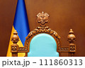 Constitutional Court of Ukraine law justice system. Empty chair judge Ukraine flag in courtroom background. Trial court scales of justice symbol Ukraine justice reform 111860313