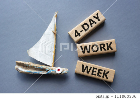 4-day work week symbol. Concept words 4-day work week on wooden blocks. Beautiful grey background with boat. Business and 4-day work week concept. Copy space 111860536