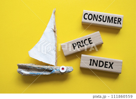 Consumer Price Index symbol. Concept words Consumer Price Index on wooden blocks. Beautiful yellow background with boat. Business and Consumer Price Index concept. Copy space. 111860559