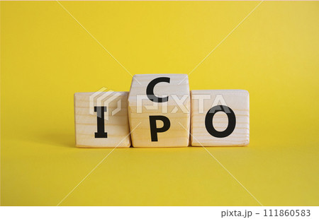 ICO and IPO symbol. Wooden cubes with words ICO - initial coin offering and IPO - initial public offering. Beautiful yellow background. Business concept. Copy space ICO and IPO symbol. Wooden cubes with words ICO - initial coin offering and IPO - initial public offering. Beautiful yellow background. Business concept. Copy space 111860583