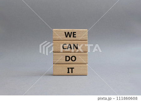 We can do it symbol. Concept words We can do it on wooden blocks. Beautiful grey background. Business and We can do it concept. Copy space. 111860608