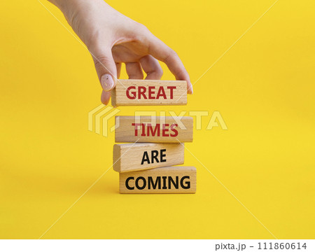 Great times are coming symbol. Concept words Great times are coming on wooden blocks. Businessman hand. Beautiful yellow background. Business and Great times are coming concept. Copy space. Great times are coming symbol. Concept words Great times are coming on wooden blocks. Businessman hand. Beautiful yellow background. Business and Great times are coming concept. Copy space. 111860614