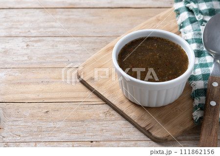 Green Chimichurri Sauce on wooden table 111862156