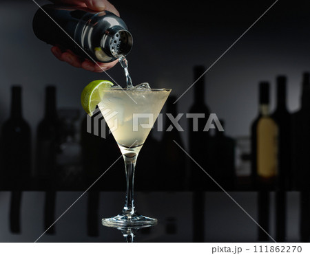 Cocktail Daiquiri on a black table in a bar. Cocktail Daiquiri on a black table in a bar. 111862270