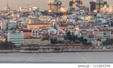 Aerial view of Lisbon skyline with Amoreiras shooping center towers timelapse from Almada at sunset. Lisbon, Portugal 111863704