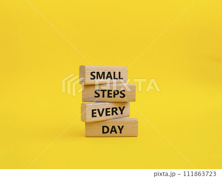 Small Steps Every Day symbol. Wooden blocks with words Small Steps Every Day. Beautiful yellow background. Business and Small Steps Every Day concept. Copy space. 111863723