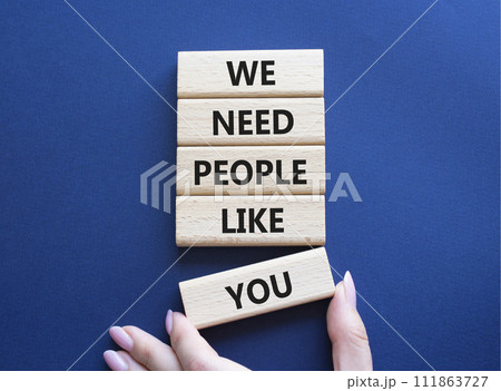 Hiring symbol. Wooden blocks with words We need People like You. Businessman hand. Beautiful deep blue background. Business and Hiring concept. Copy space. 111863727