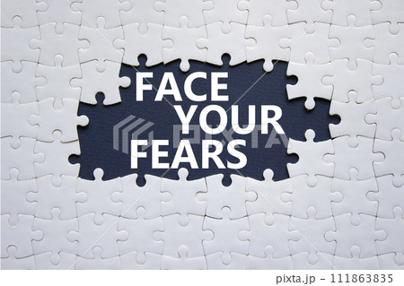 Face your Fears symbol. Concept words Face your Fears on white puzzle. Beautiful deep blue background. Business and Face your Fears. Copy space. Face your Fears symbol. Concept words Face your Fears on white puzzle. Beautiful deep blue background. Business and Face your Fears. Copy space. 111863835