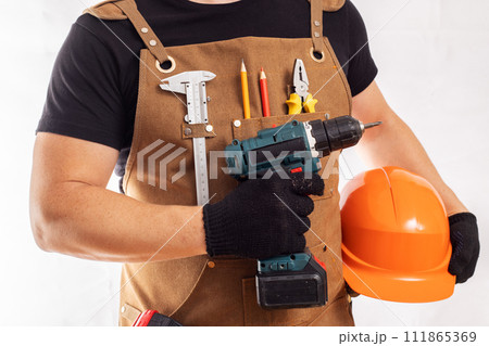 Handyman with Power Drill and Safety Gear 111865369
